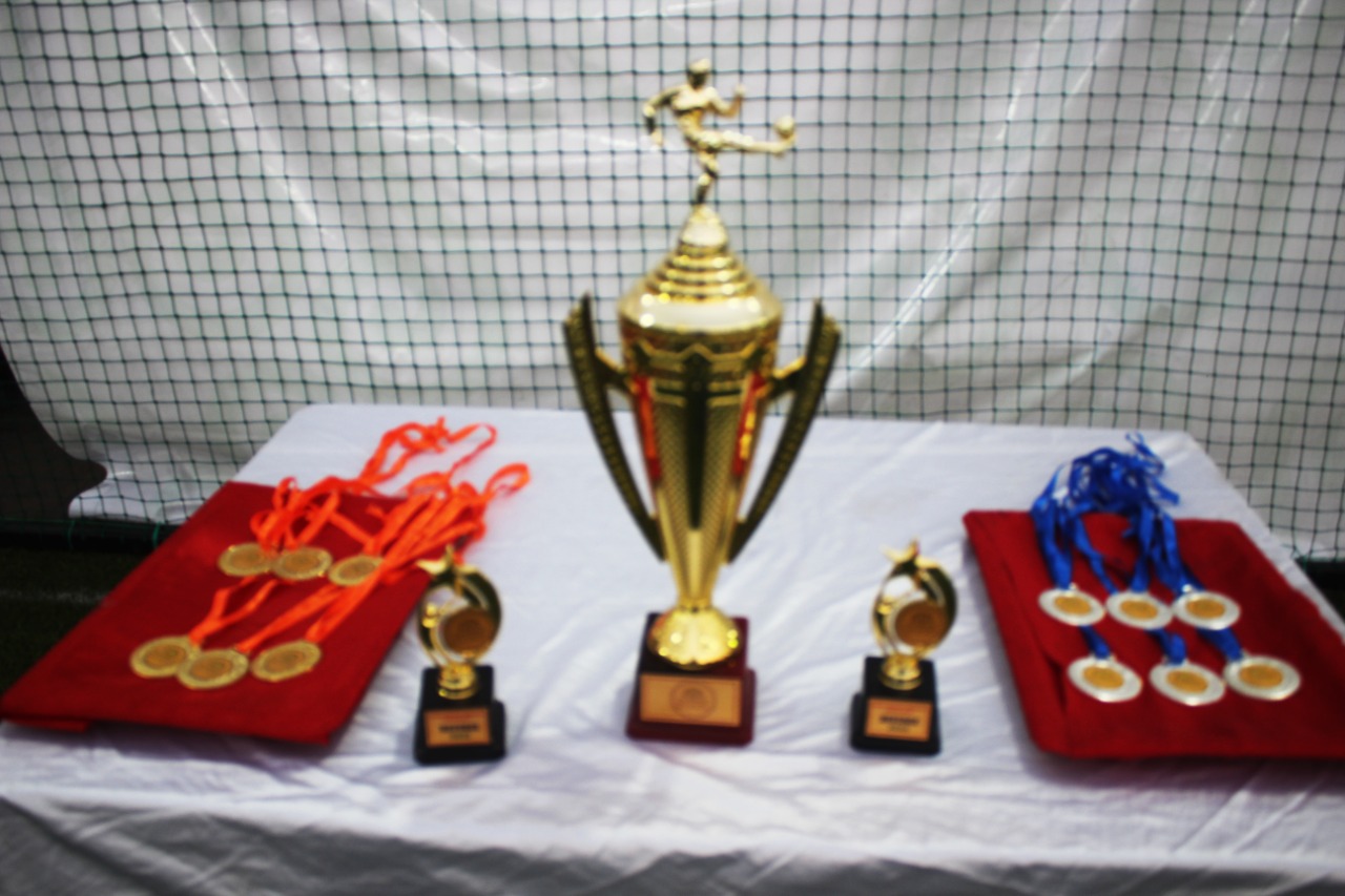 Winning trophies at IQ City UWSB Intra College Football Tournament 2022